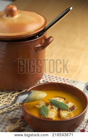 Pumpkin soup and leeks, with sage leaves.