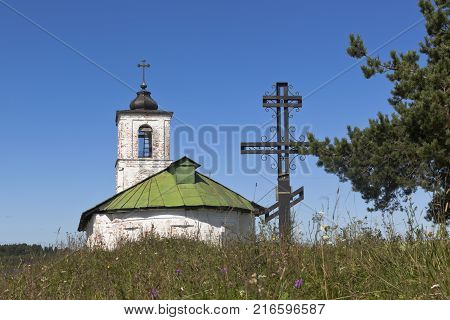Worship cross near Church of Introduction of Blessed Virgin Mary to the Temple in the village of Goritsy Vologda Region, Russia