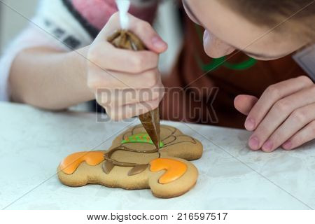 Homemade Christmas Gingerbread Decorated In The Form Of Mittens On The Background Of A White Napkin