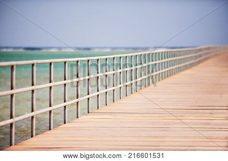 Long wooden jetty on the Red Sea. Pontoon jetty. Egypt.