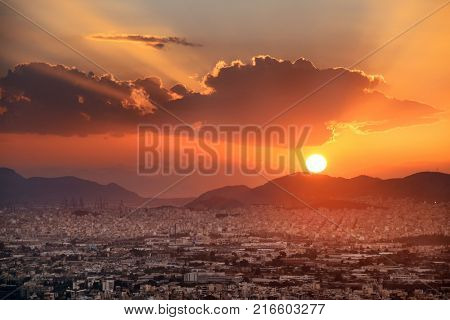 Athens skyline sunset viewed from Mt Lykavitos with Acropolis, Greece.
