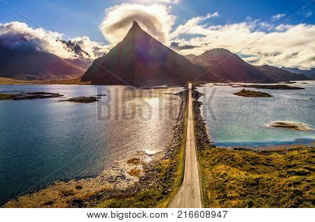 Aerial view of a scenic coastal road on Lofoten islands in Norway on a sunny autumn day. HDR processed.