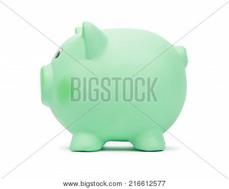 Green ceramic piggy bank, isolated on white background. Ecology investment, money for sustainable green energy, saving on costs, save the Earth concept.