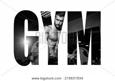 Athletic young man doing exercises with barbell in gym. Handsome muscular bodybuilder guy is working out. Monochrome image. Motivation sign