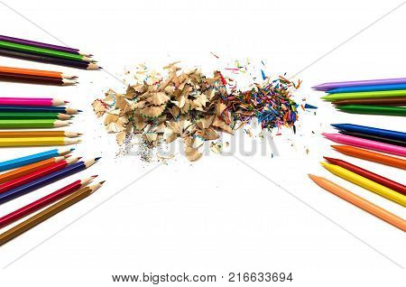 Color pencils and shavings from a color pencils isolated on white background.