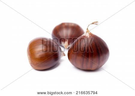 Tasty ripe chestnuts isolated on white background