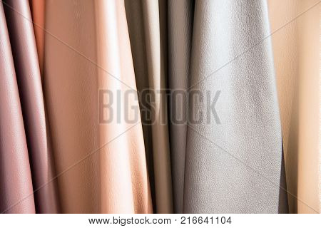Color palette sample of leather material as a background.