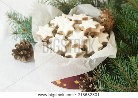 Cookies Cinnamon Star In A Tin Box On A Background Of Fir Branches And Cones.