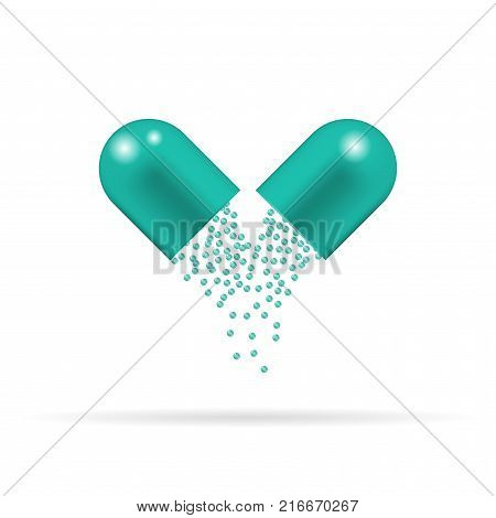 Capsule pill with green granules which are sprinkling and falling down. Tablet isolated on the white background.