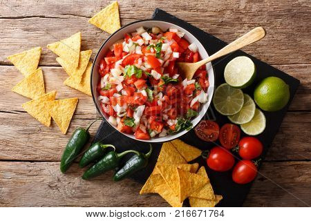 Pieces Of Chicken Stew With Potatoes, Peppers, Tomatoes, Peas And Onions Close-up. Vertical Top View