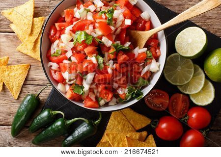 Pieces Of Chicken Stew With Potatoes, Peppers, Tomatoes, Peas And Onions Close-up. Vertical Top View