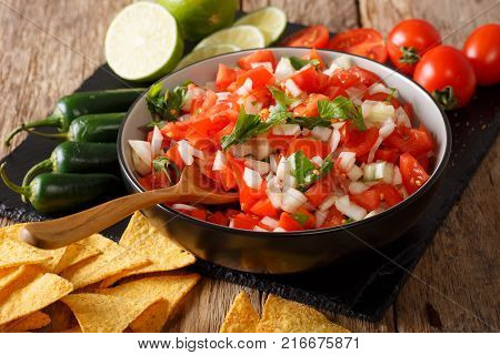 Pieces Of Chicken Stew With Potatoes, Peppers, Tomatoes, Peas And Onions Close-up. Vertical Top View