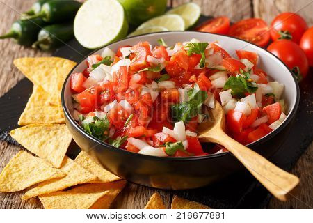 Pieces Of Chicken Stew With Potatoes, Peppers, Tomatoes, Peas And Onions Close-up. Vertical Top View