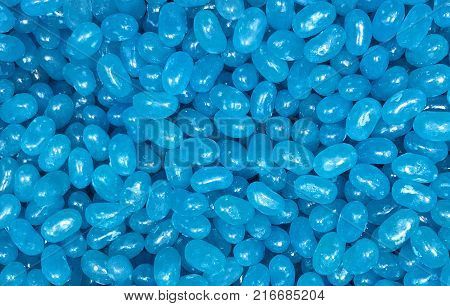 Colorful light blue jellybeans with space for text. Can be used as a background.