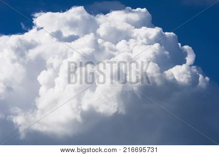 Thick and dense white clouds on the blue sky background