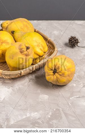 Close-up of ripe quince fruits on kitchen countertop.