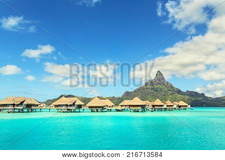 Otemanu mountain and luxury bungalow at Bora Bora island Tahiti French Polynesia