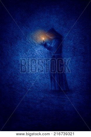 Lonely monk in a cave with a candle