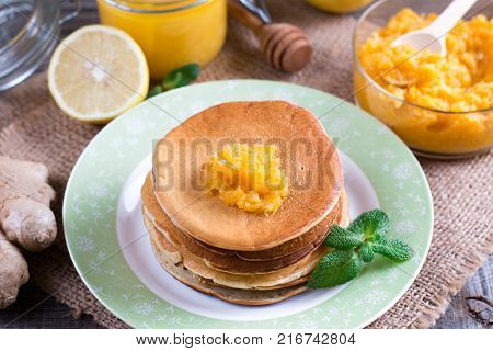 Healthy breakfast. Homemade punkcakes with lemon and honey