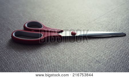 scisors with red plastic handle. Instagram toning