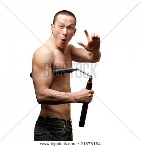 funny muscular shaolin monk with nunchaku in his hands