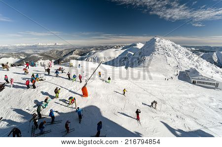 Skiers in Cold snowy winter in Low Tatras mountains. Hill Chopok cottage Kamienka Slovakia