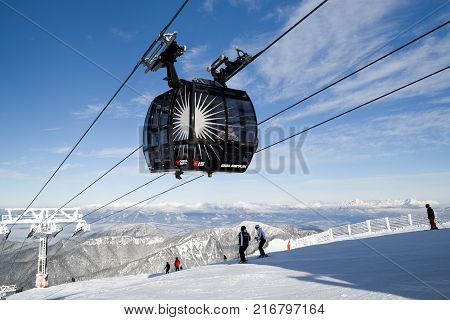JASNA SLOVAKIA - DECEMBER 2: Ropeway Funitel and skiers on hill Chopok in resort Jasna in Low Tatras mountains on December 2 2017 in Jasna