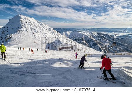 JASNA SLOVAKIA - DECEMBER 2: Ropeway and skiers on hill Chopok in resort Jasna in Low Tatras mountains on December 2 2017 in JasnaJ