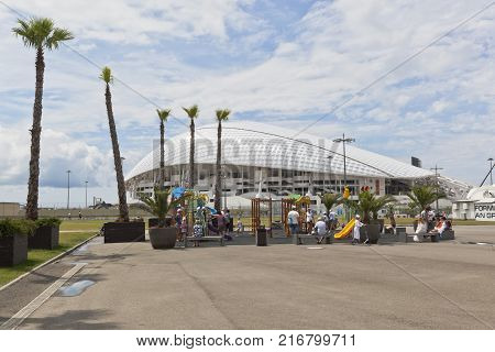 Adler, Krasnodar region, Russia - July 8, 2016: Playground in the Sochi Olympic Park against a background the Olympic Stadium 
