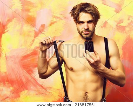 Caucasian Bearded Sexy Macho Man Holding Red Packages Or Bags