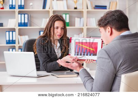 Business meeting between businessman and businesswoman