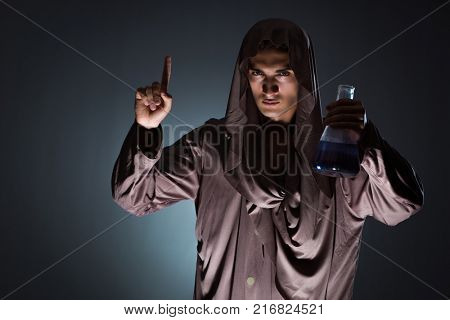 Alchemist doing experiments in alchemy concept