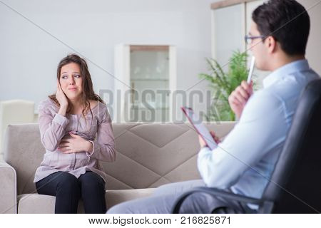 Pregnant woman visiting psychologist doctor