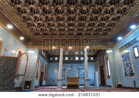 Cairo, Egypt - December 2, 2017: Interior of public mosque of Manial Palace of Prince Mohammed Ali Tewfik with wooden golden ornate ceilings Cairo Egypt