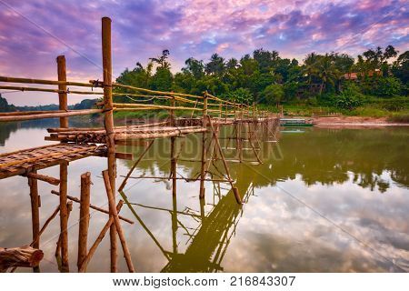 Beautiful view of a bamboo bridge. Luang Prabang. Laos landscape.
