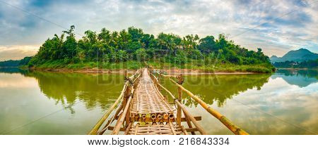 Beautiful view of a bamboo bridge. Luang Prabang. Laos landscape. Panorama