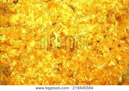 Abstraction. Goldmine. Background. A unique pattern. The color is dark brown golden yellow light yellow and white.