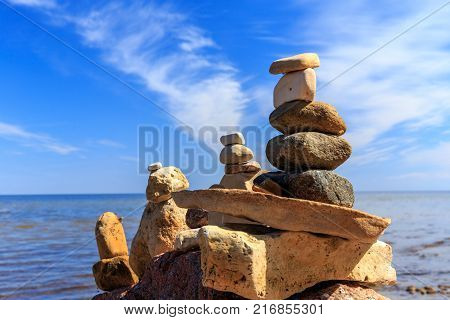 Zen balance of stones at rocky seashore