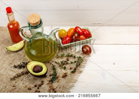 Ingredients for spring vegetable buddha bowl. Delicious healthy food. On a white wooden background, top view