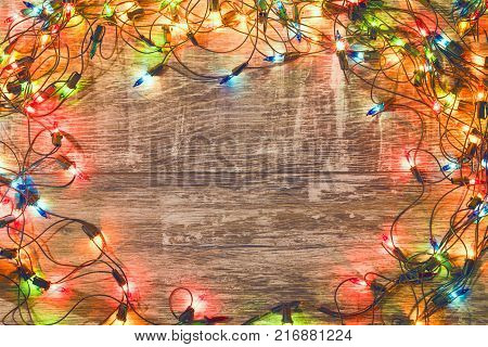 Vintage christmas background. Old Christmas garland on a wooden background. New Year background. Christmas decorations. Xmax background. Toned image.