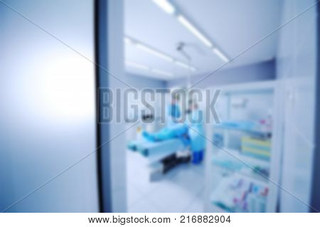 surgeons operate on a patient in the background Surgical Lamp