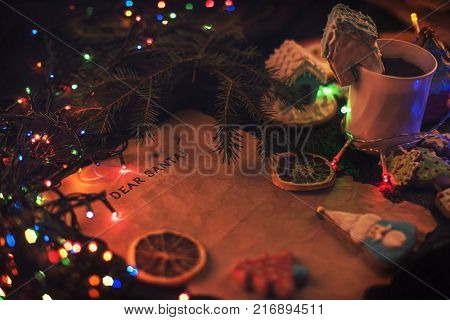 Letter for Santa on decorated chrismas background with gingerbread coocies and garland