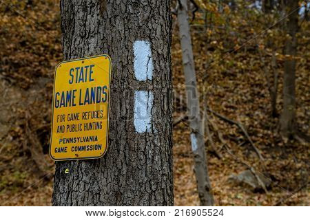 Port Clinton PA USA - December 3 2017: A State Game Lands sign at Hash Marks for the Appalachian Trail near the Schuylkill River.
