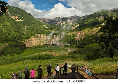 Kamchatka Peninsula, Russia - August 12, 2016: Tourists on an excursion in the Famous Valley of Geysers. Kronotsky Nature Reserve on Kamchatka Peninsula.