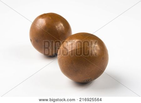 pair of copper Chinese singing balls Baoding of health for hands on white background