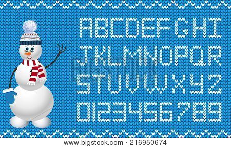Knit new year and christmas alphabet with snowman character on blue fabric background.