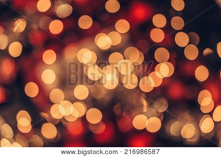 Abstract Christmas bokeh background. Red black and yellow colors