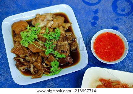 Pork chitterlings in the sweet gravy served with chili sauce Thai cuisine.