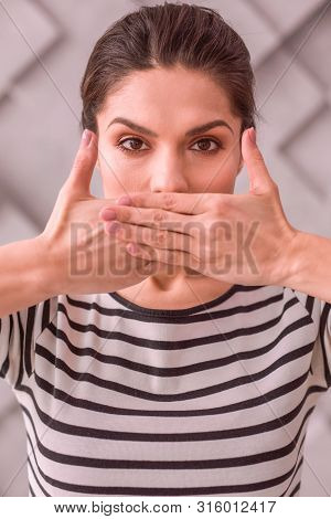 Woman Trying Not To Tell Something To Others