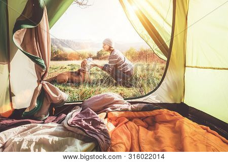 Woman Pand Her Dog Tender Scene Near The Camping Tent. Active Leisure, Traveling With Pet Concept Im